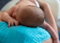 Cute 2 months little baby boy sleeping in his mothers arms Royalty Free Stock Photo