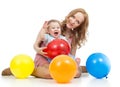 Cute mother and baby with balloons having fun