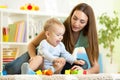 Cute mother and kid boy playing together indoor Royalty Free Stock Photo