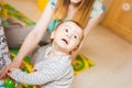 Cute mother and kid boy playing together indoor Royalty Free Stock Photo