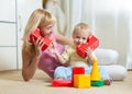 Cute mother and kid boy playing together indoor Royalty Free Stock Photo