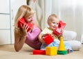 Cute mother and kid boy playing together indoor Royalty Free Stock Photo