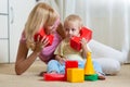 Cute mother and child boy role playing together at home