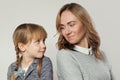 Cute mother and little daughter look at each other. Happy family Royalty Free Stock Photo