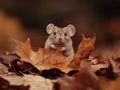 Cute mouse sitting on between autumn leaves Royalty Free Stock Photo