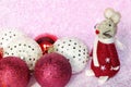 Cute mouse toy with christmas baubles balls on blurred christmas background with lights bokeh. Xmas rat is symbol of New year 2020 Royalty Free Stock Photo