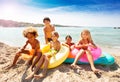 Cute multiethnic kids spending summer on the beach