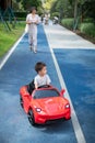 Little boy is riding in a remote controlled car Royalty Free Stock Photo