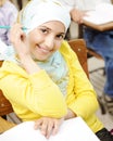 Cute Muslim arabic girl sitting on the chair