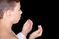 Cute Muslim Kid Praying While Wearing Ihram During Hajj Royalty Free Stock Photo