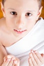 Cute Muslim Kid Praying While Wearing Ihram During Hajj Royalty Free Stock Photo