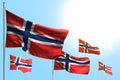 Cute 5 flags of Norway are wave against blue sky picture with bokeh - any holiday flag 3d illustration Royalty Free Stock Photo