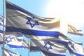 Cute national holiday flag 3d illustration - many Israel flags are waving against blue sky picture with selective focus