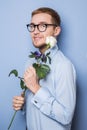Cute nerd with a white rose. Date, birthday, Valentine