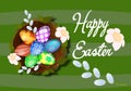 Cute nest with eggs for easter on a green background