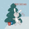 Cute New Year's rabbit near the Christmas tree with gifts. Chinese character for 2023. Symbol of the year. Vector Royalty Free Stock Photo
