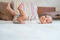 Cute newborn baby boy at home lying on bed Royalty Free Stock Photo