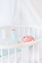Cute newborn baby boy in white bed with canopy Royalty Free Stock Photo