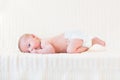 Cute newborn baby boy on a white knitetd blanket Royalty Free Stock Photo