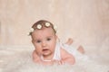 Cute newborn baby girl, lying on the bed, looking at camera Royalty Free Stock Photo