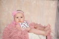 Cute newborn baby girl, lying on the bed, looking at camera Royalty Free Stock Photo