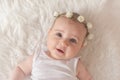 Cute newborn baby girl, lying on the bed, looking at camera Royalty Free Stock Photo