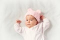 Cute newborn baby girl lying in the bed Royalty Free Stock Photo