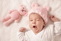 Cute newborn baby girl lying in the bed Royalty Free Stock Photo