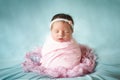 Newborn baby girl peacefully sleeping in a potato sack pose Royalty Free Stock Photo