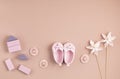 Cute newborn baby girl shoes with festive decoration over pink background. Baby shower, birthday, invitation or greeting card Royalty Free Stock Photo