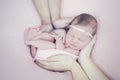 Cute newborn baby girl sleeping in parents hands Royalty Free Stock Photo