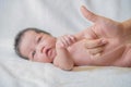 Cute newborn baby hand holding mother's finger Royalty Free Stock Photo