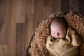 Cute newborn baby sleeping on fluffy soft blanket