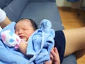 Cute newborn baby sleeping in hands of parents. Royalty Free Stock Photo