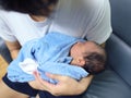 Cute newborn baby sleeping in hands of parents Royalty Free Stock Photo