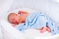 Cute newborn baby in white bed Royalty Free Stock Photo