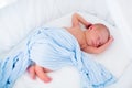 Cute newborn baby in white bed Royalty Free Stock Photo