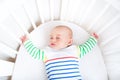 Cute newborn little boy sleeping in round crib Royalty Free Stock Photo