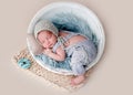 Cute newborn sleeping in round cradle Royalty Free Stock Photo