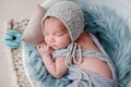 Cute newborn sleeping in round cradle Royalty Free Stock Photo