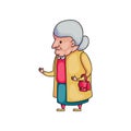 Cute old grandmother in yellow coat with red handbag