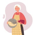 Cute old woman cooks with prosthetic arm