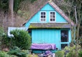 Cute old wooden house in light blue with red roof tiles 2 Royalty Free Stock Photo