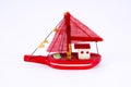 Cute old wooden red fishing boat isolated