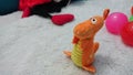Cute orange dinosaur doll