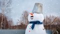 Cute outdoor snowman. Snowy new year`s Christmas fun
