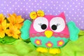 Cute owl is sewn of felt and decorated with lace and bow. Children's toy Royalty Free Stock Photo
