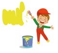 Cute painter boy painting a wall