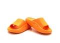 Cute pair of orange pillow slide sandals for toddler non-slip foam slippers isolated on white Royalty Free Stock Photo