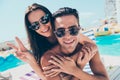 Cute pair spending honeymoon enjoying relaxation and sunny day showing v-sign symbol Royalty Free Stock Photo